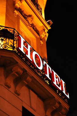 Hotel facade at night clipart