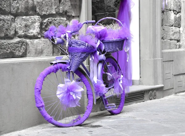 Stock image A bicycle wrapped in purple fabric