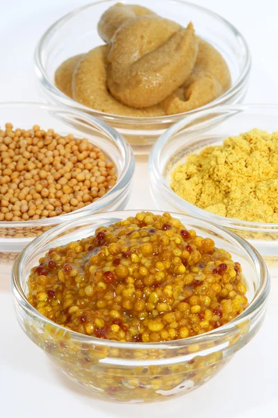 Mustard in a glass container — Stock Photo, Image