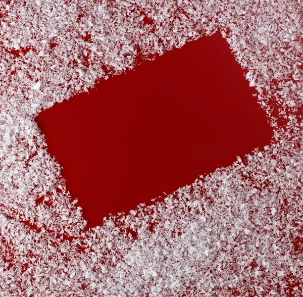 赤いクリスマスの背景に白い雪の罫線 ロイヤリティフリーのストック写真