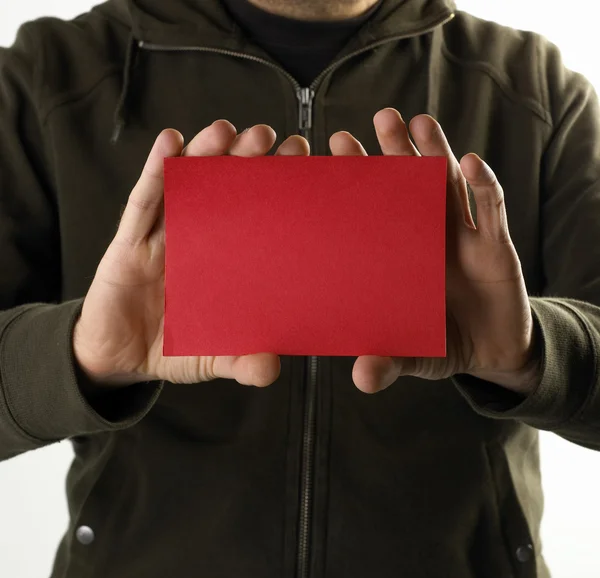 Young man with an red empty card Stock Photo