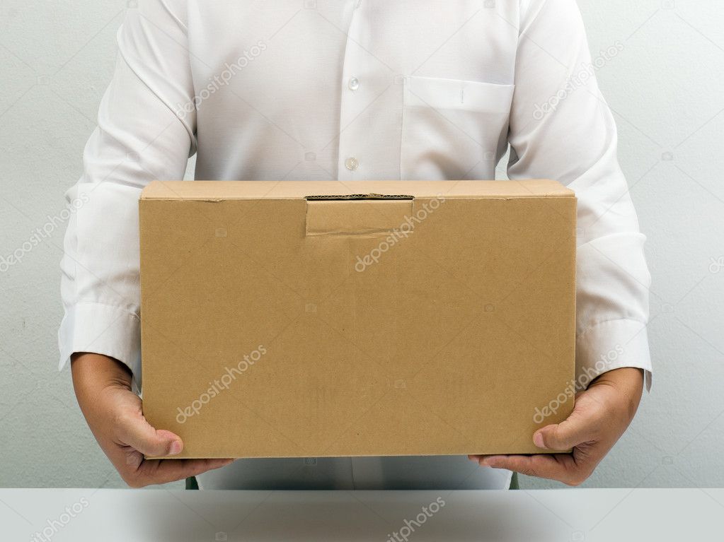Man carry brown paper box