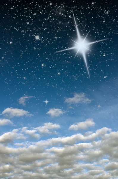 Bright star in blue sky — Stock Photo, Image