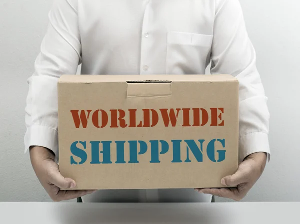 stock image Worldwide Shipping brown paper box