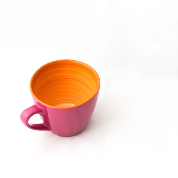 Рожева та помаранчева керамічна чашка — стокове фото