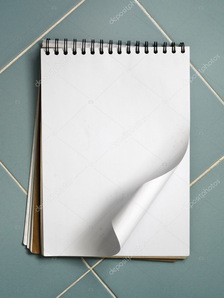 Blank white sketch book on blue