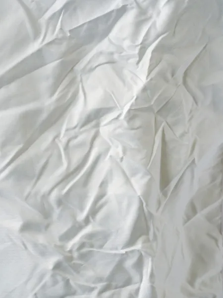 Povrch vrásčitá bílý ubrus — Stock fotografie