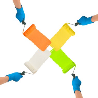 Hands with rollers dipped in bright colors paint each other trac clipart