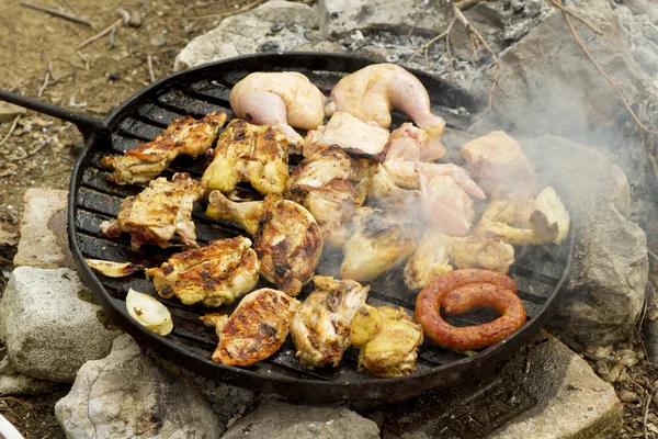 Grill over open fire with meat and chicken — Stock Photo, Image
