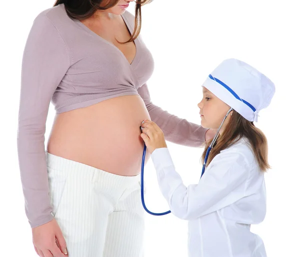 Těhotná žena se svou dcerou Stock Snímky