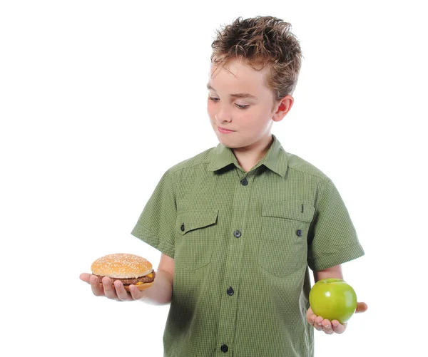 stock image Little boy eating a hamburger
