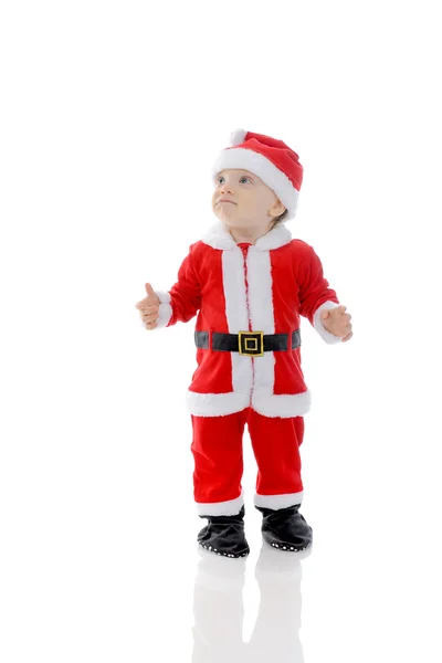 Menino alegre em chapéu de Papai Noel — Fotografia de Stock