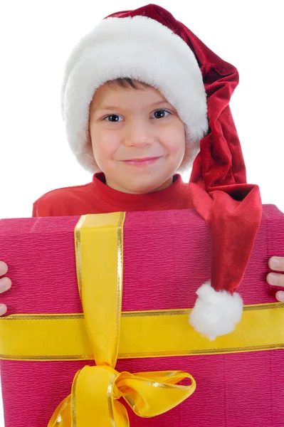 Fröhlicher Junge mit Weihnachtsmann-Hut — Stockfoto