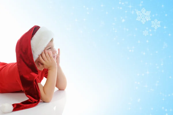 Cheerful boy in Santa Claus hat — Stock Photo, Image
