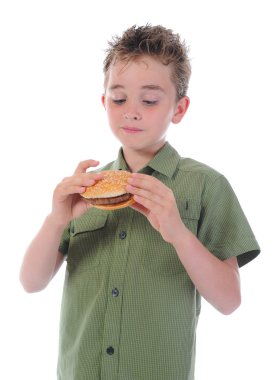 Little boy eating a hamburger clipart