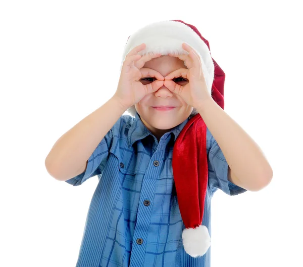 Ragazzo allegro in cappello di Babbo Natale — Foto Stock