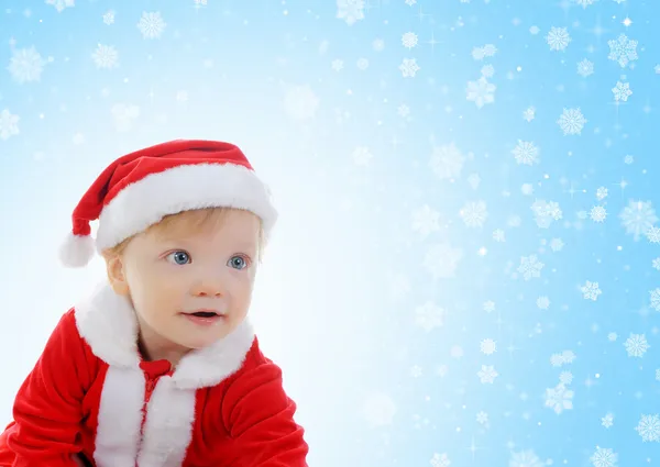 Menino alegre em chapéu de Papai Noel — Fotografia de Stock