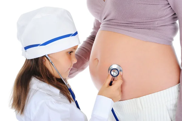 Zwangere vrouw met haar dochter — Stockfoto