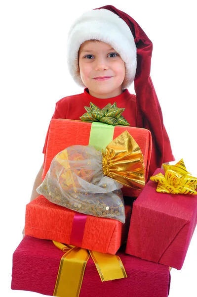 Garçon joyeux dans le chapeau du Père Noël Photos De Stock Libres De Droits
