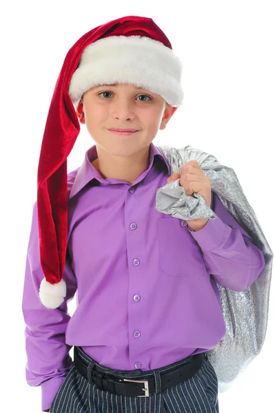 Wesoły chłopak w santa claus kapelusz — Zdjęcie stockowe