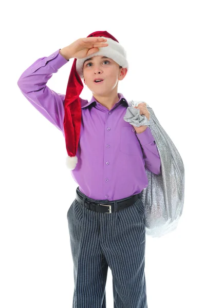 Wesoły chłopak w santa claus kapelusz — Zdjęcie stockowe