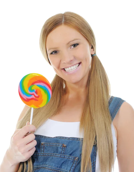 Happy curly woman with a lollipop — Stock Photo, Image