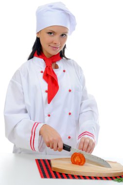 Chef cuts the tomato clipart