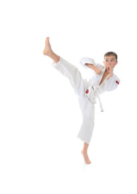 Young boy training karate. clipart