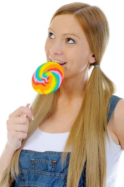 Happy curly woman with a lollipop — Stock Photo, Image