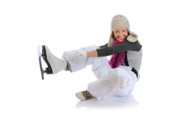 Beautiful girl puts on skates — Stok fotoğraf