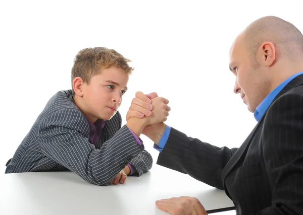 Boy and a man arm wrestling — Stock Photo, Image