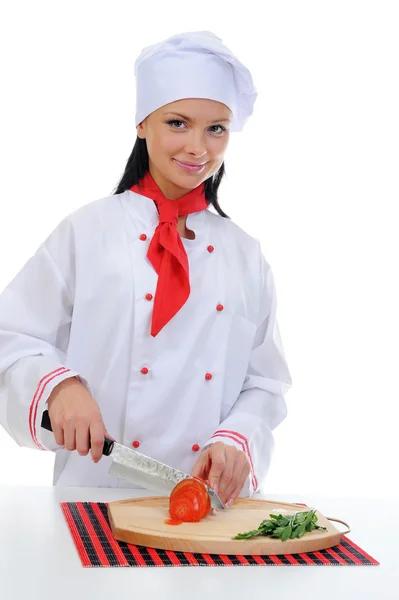 Koch schneidet die Tomate — Stockfoto