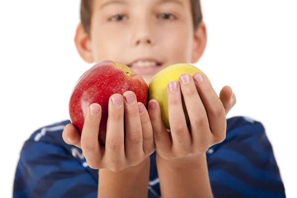 stock image The boy holds two apples