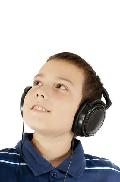 The boy listens to music Stock Image