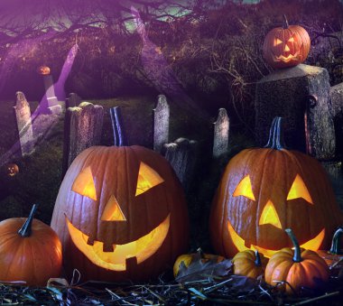 Halloween pumpkins in the grave yard clipart