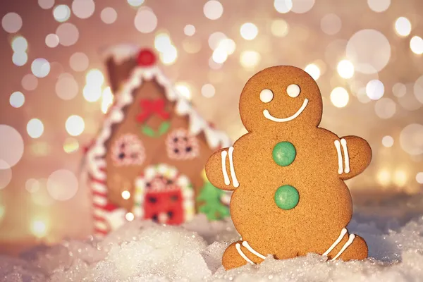 stock image Gingerbread man cookie standing beside house