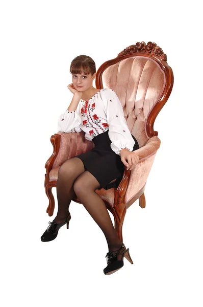 Mädchen im rosa Sessel. — Stockfoto