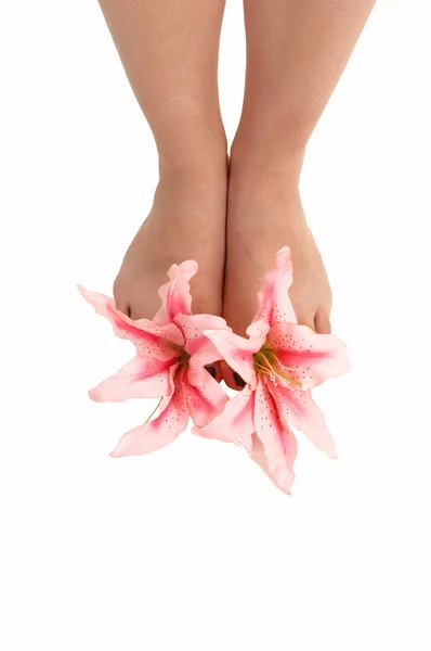 Feet with lilies. — Stock Photo, Image