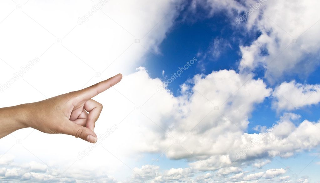 Hand on the blue clear sky