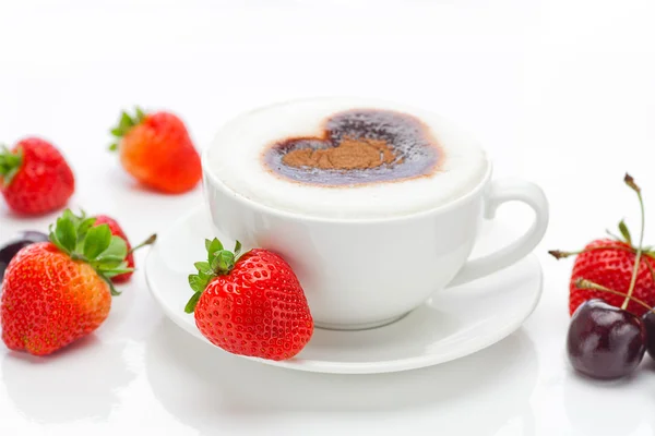 Cappuccino in a cup in the shape of hearts,cherry and strawberr — Stok fotoğraf