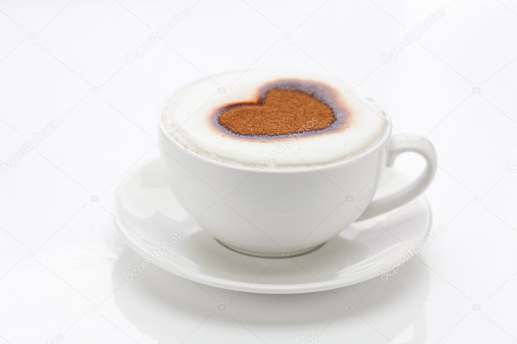 Cappuccino in a cup in the shape of hearts isolated on white