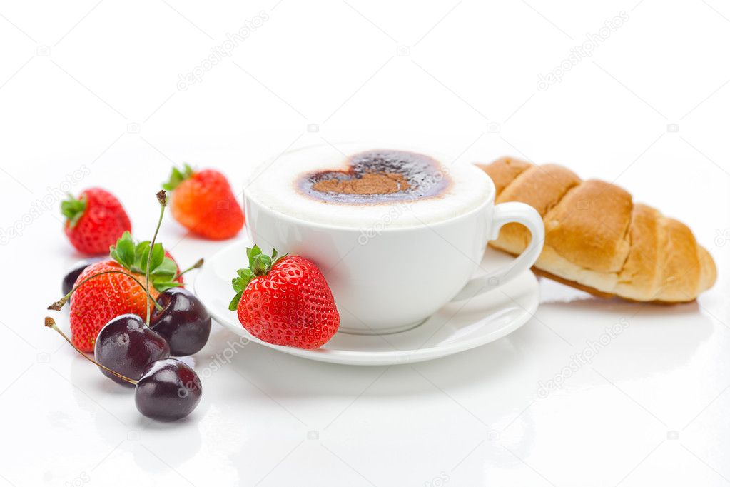 Cappuccino in a cup in the shape of hearts,cherry,croissant and