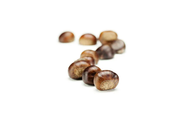 Big shiny chestnuts isolated on white — Stock Photo, Image
