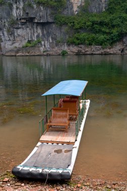 Bamboo raft in Li River clipart