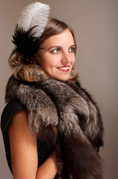 Retro woman with feather and fur — Stock Photo, Image