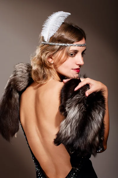 Woman in evening dress and fur — Stock Photo, Image