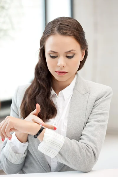Businesswoman with watch — Stock Photo, Image
