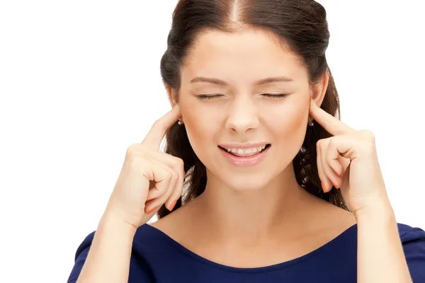 Woman with fingers in ears — Stock Photo, Image