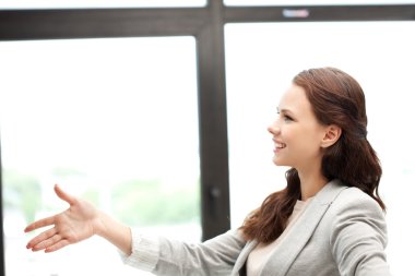 Woman with an open hand ready for handshake clipart