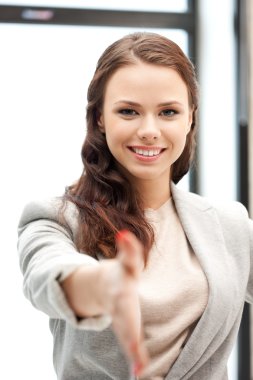 Woman with an open hand ready for handshake clipart